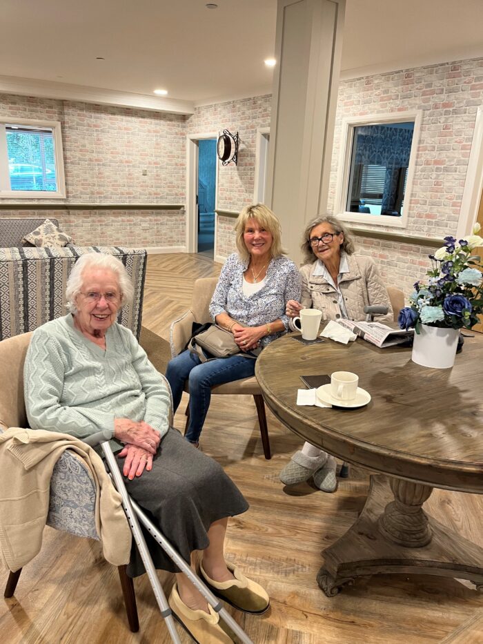 Residents and community members enjoying coffee and conversation together during a community coffee morning at Beeston Rise.