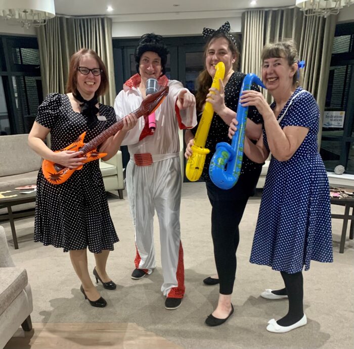 Care home resident themes day Elvis celebration, care home team in costumes