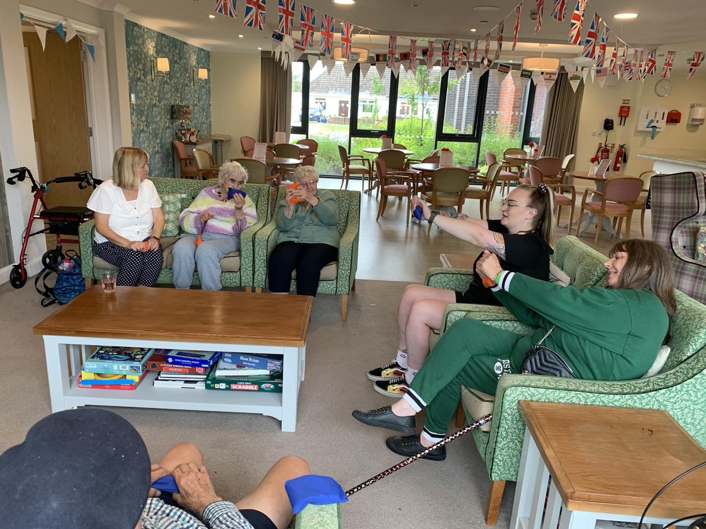 Be Great Fitness activity instructor leads a work-out with residents from Richard House care home.