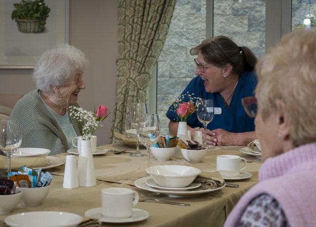 Tanglewood's care team interacting with a resident.