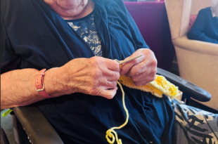 Community Unites to Knit Record-Breaking Scarf in Aid of Dementia UK