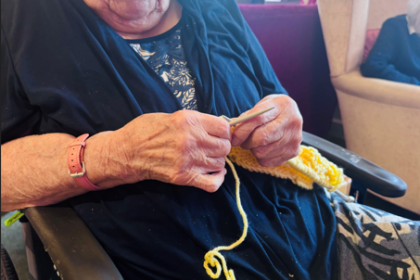 Community Unites to Knit Record-Breaking Scarf in Aid of Dementia UK