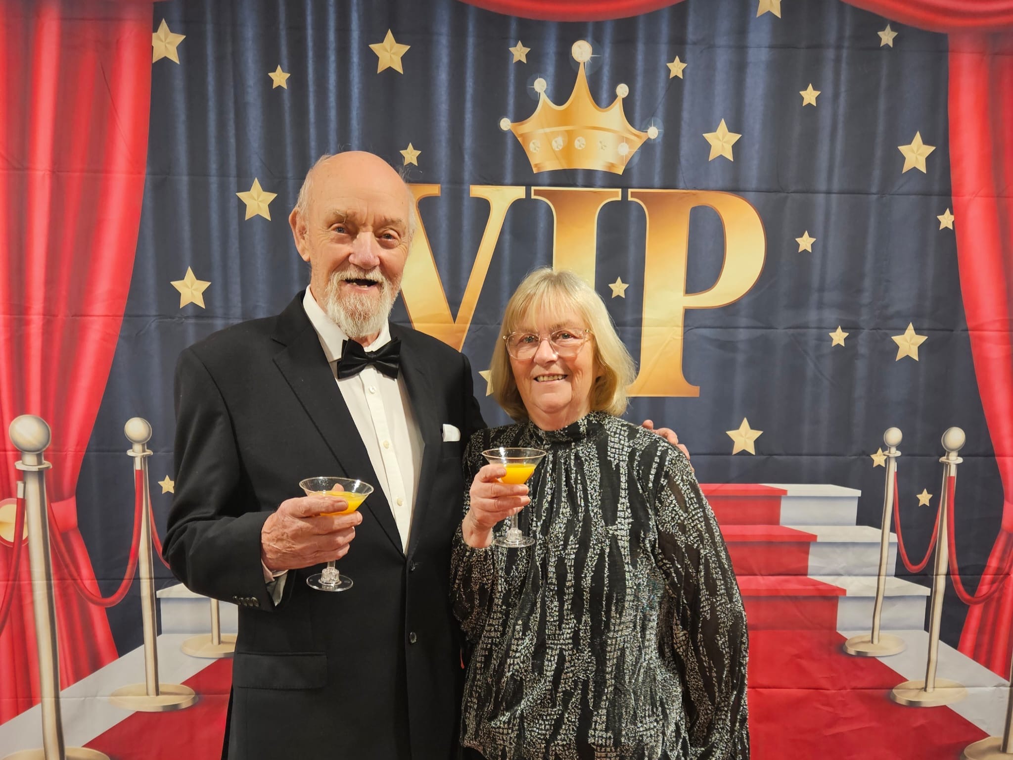 A couple smiling at the York Manor care home 1 year anniversary celebration