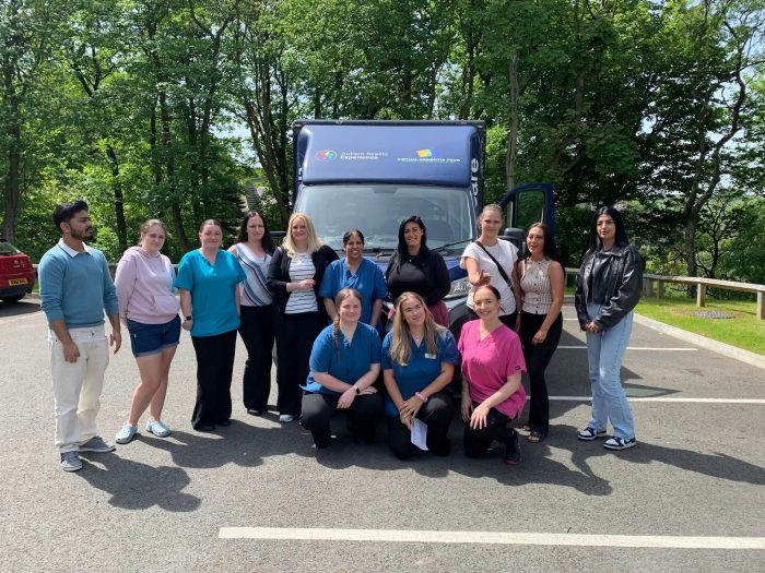 Staff members at Bingley Park Care Home stand together outdoors following the home's first Care Quality Commission (CQC) inspection, which awarded a Good rating across all five assessment areas.