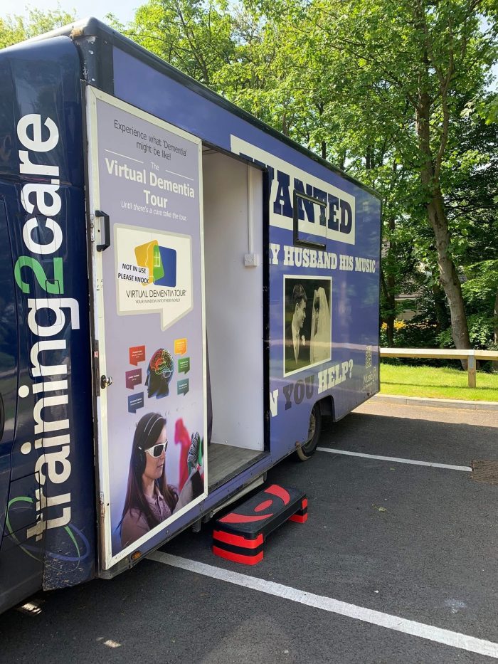 The Virtual Dementia Tour mobile training unit visits a care home, providing immersive dementia awareness experiences to help staff better understand the challenges faced by people living with dementia.
