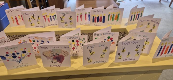 Birthday cards for Gwen’s 102nd birthday displayed on tables at Toray Pines.