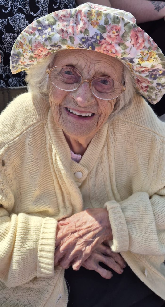 Birthday girl Gwen smiling on her 102nd birthday at Toray Pines care home in Coningsby